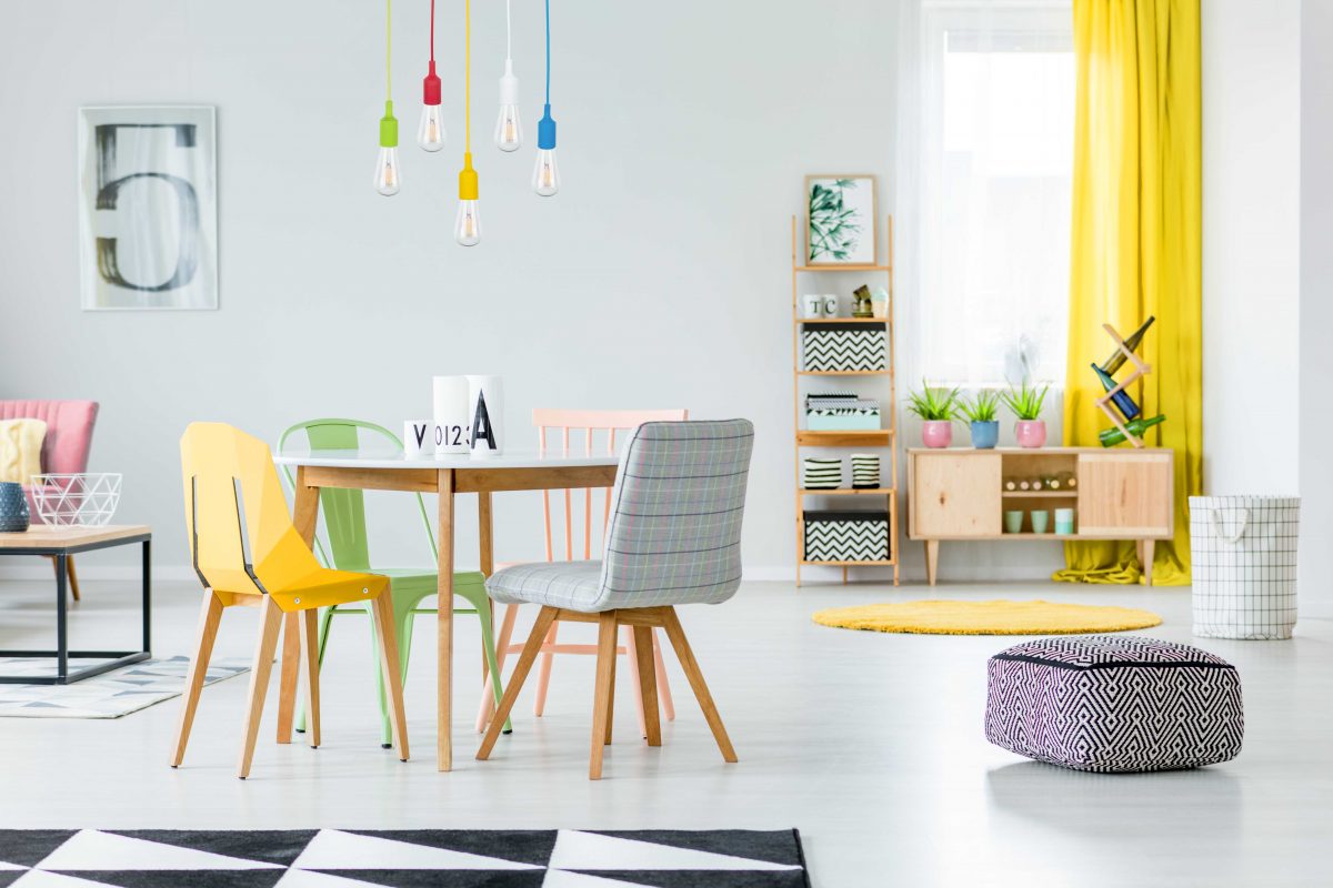 Patterned,,black,and,white,pouf,in,pastel,dining,room,interior